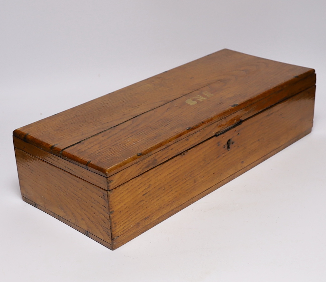 An oak Colt pistol box, felt lined compartments containing a few tools including a bullet mould, label for directions to the inside of the lid, dimensions 45.5 x 18 x 11.5cm